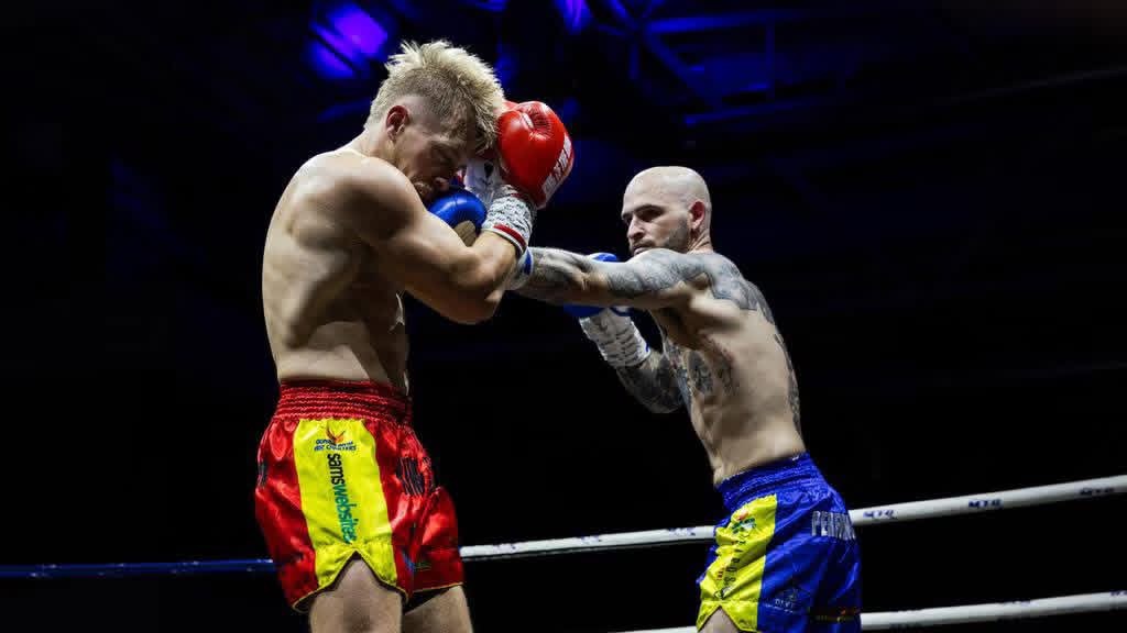 Two fighters trading shots in the centre of the ring